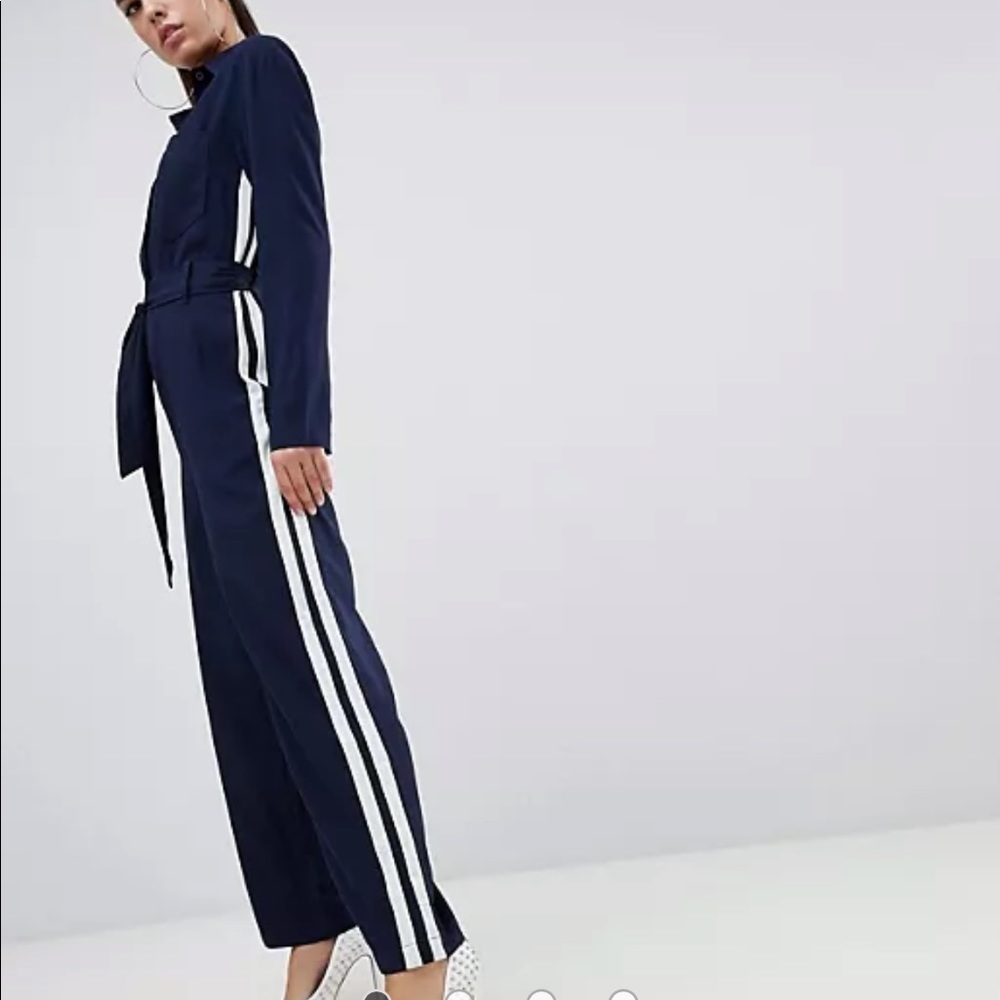 Navy collared jumpsuit with side stripe and tie belt. Brand new, never worn.